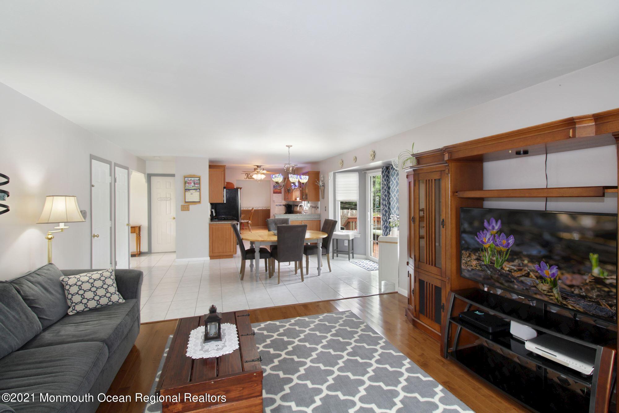 8 Derringer Drive Howell, NJ 07731 - Photo 13 of 33 a living room with furniture and a flat screen tv