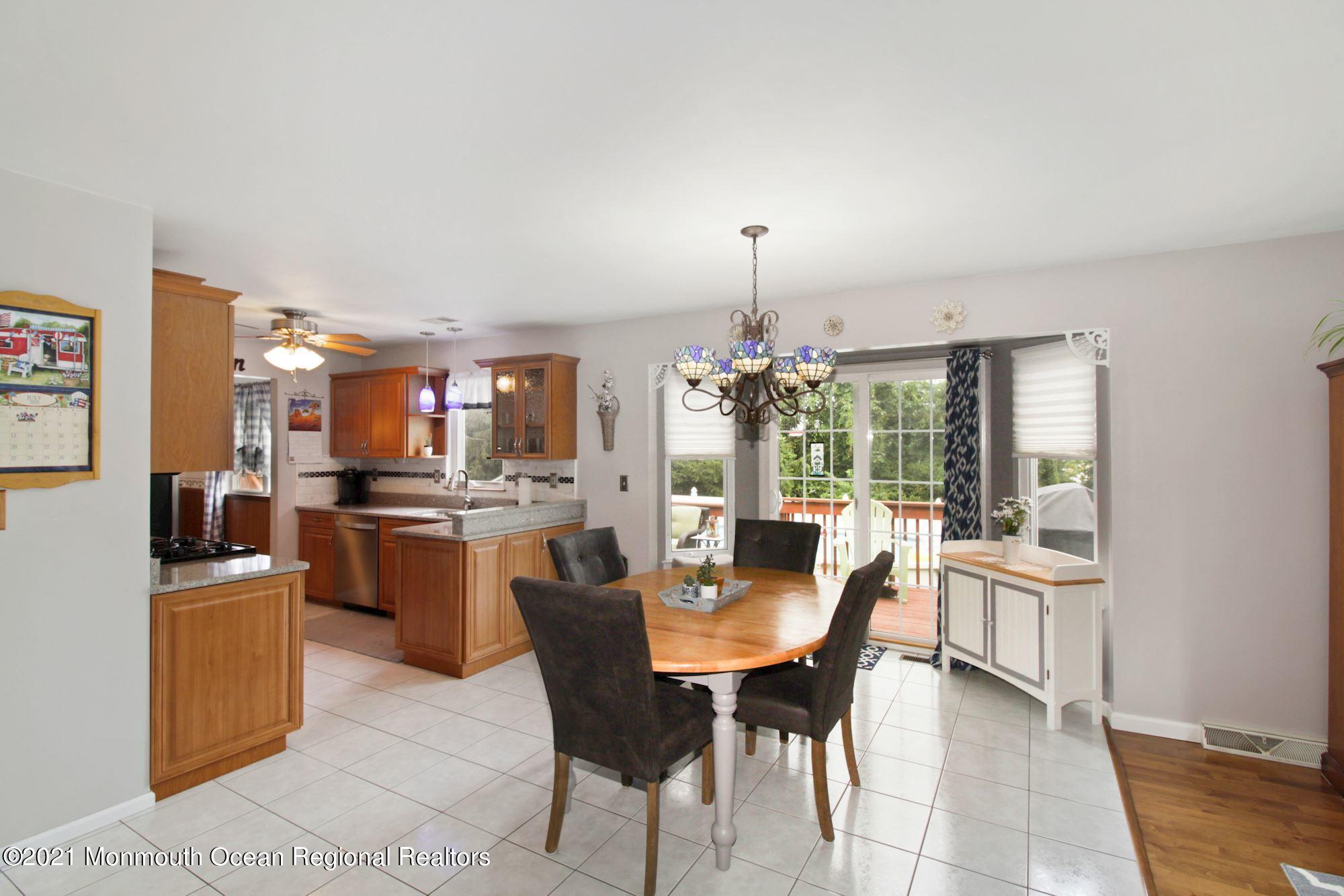 8 Derringer Drive Howell, NJ 07731 - Photo 14 of 33 a dining area with furniture and window