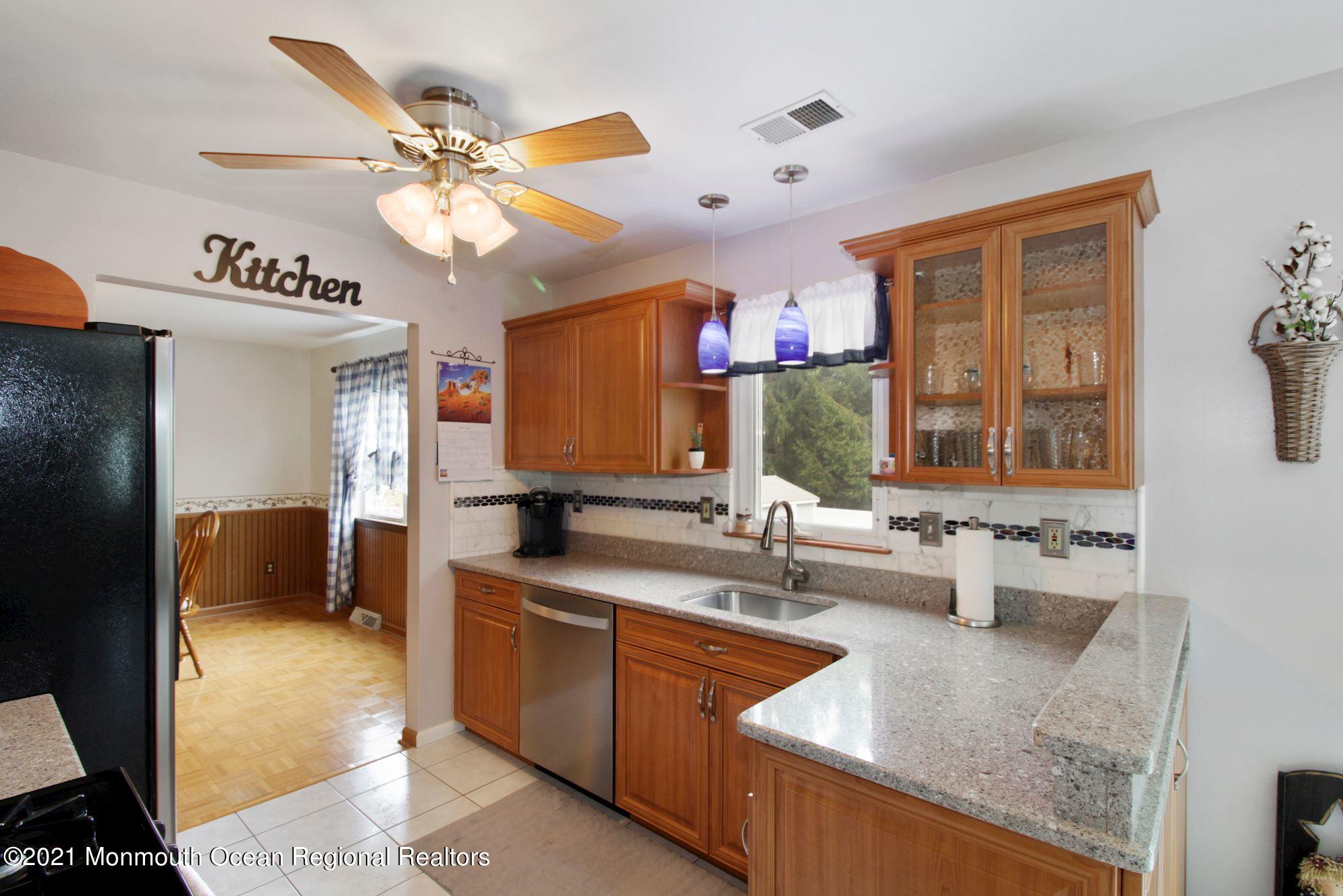8 Derringer Drive Howell, NJ 07731 - Photo 16 of 33 a kitchen with a sink stove and refrigerator