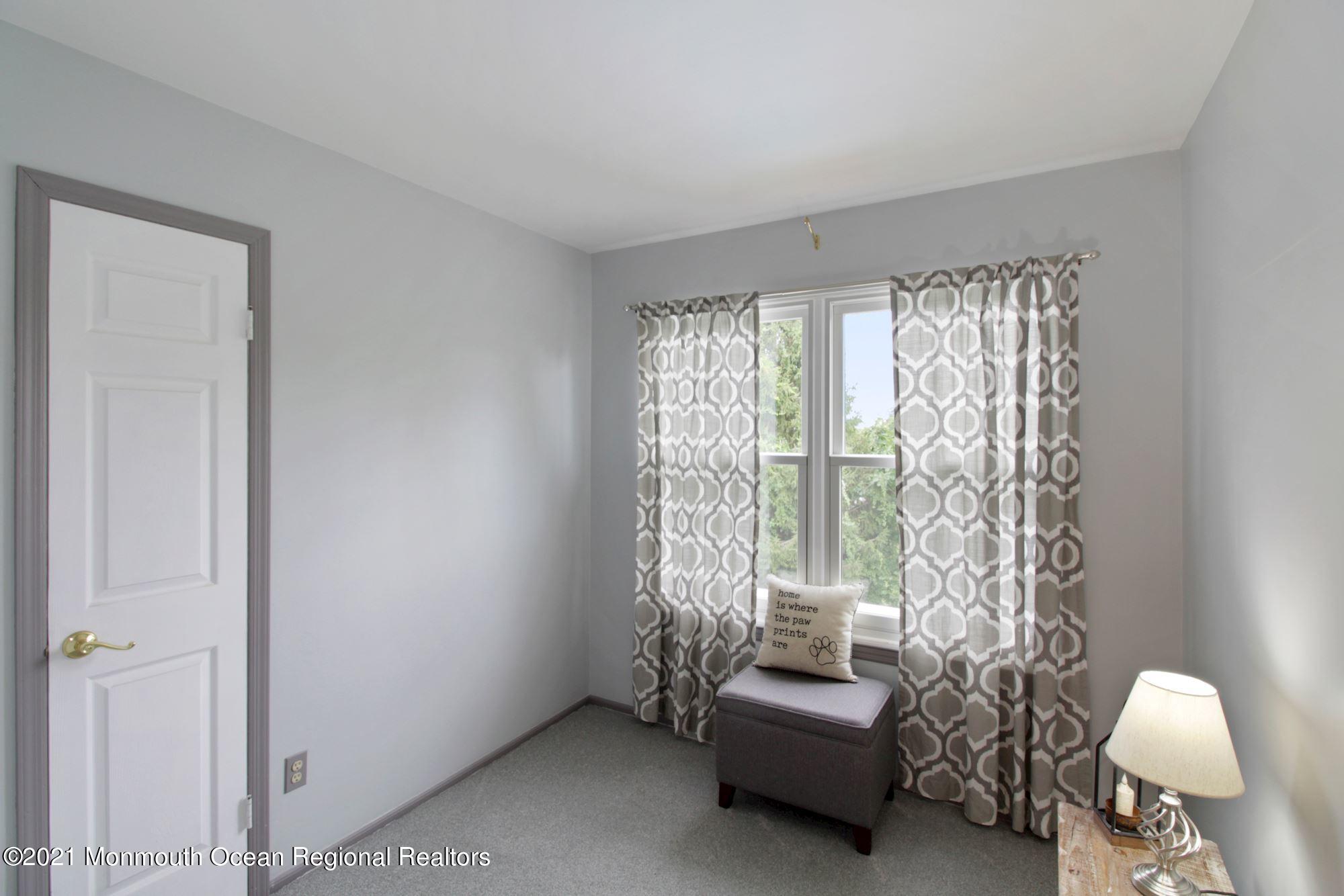 8 Derringer Drive Howell, NJ 07731 - Photo 25 of 33 a living room with furniture and a large window