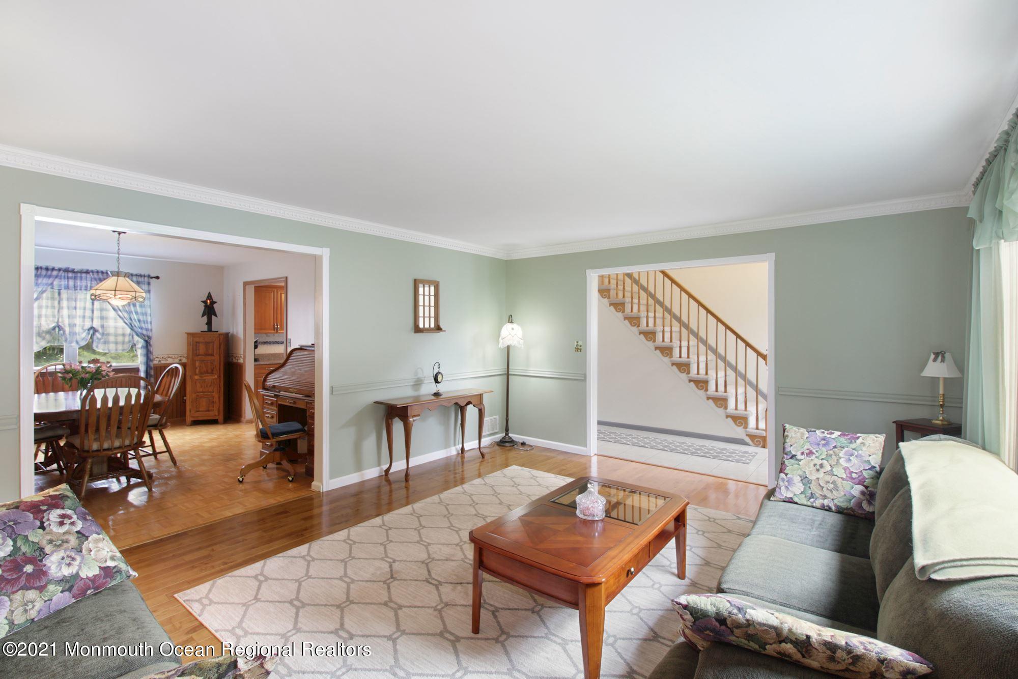 8 Derringer Drive Howell, NJ 07731 - Photo 7 of 33 a living room with furniture and wooden floor