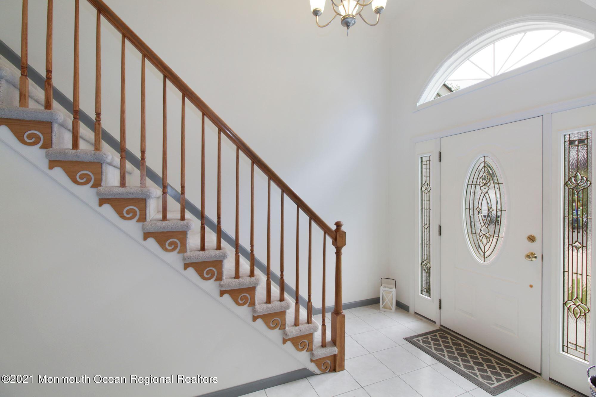 8 Derringer Drive Howell, NJ 07731 - Photo 10 of 33 a view of staircase with wooden floor and stairs