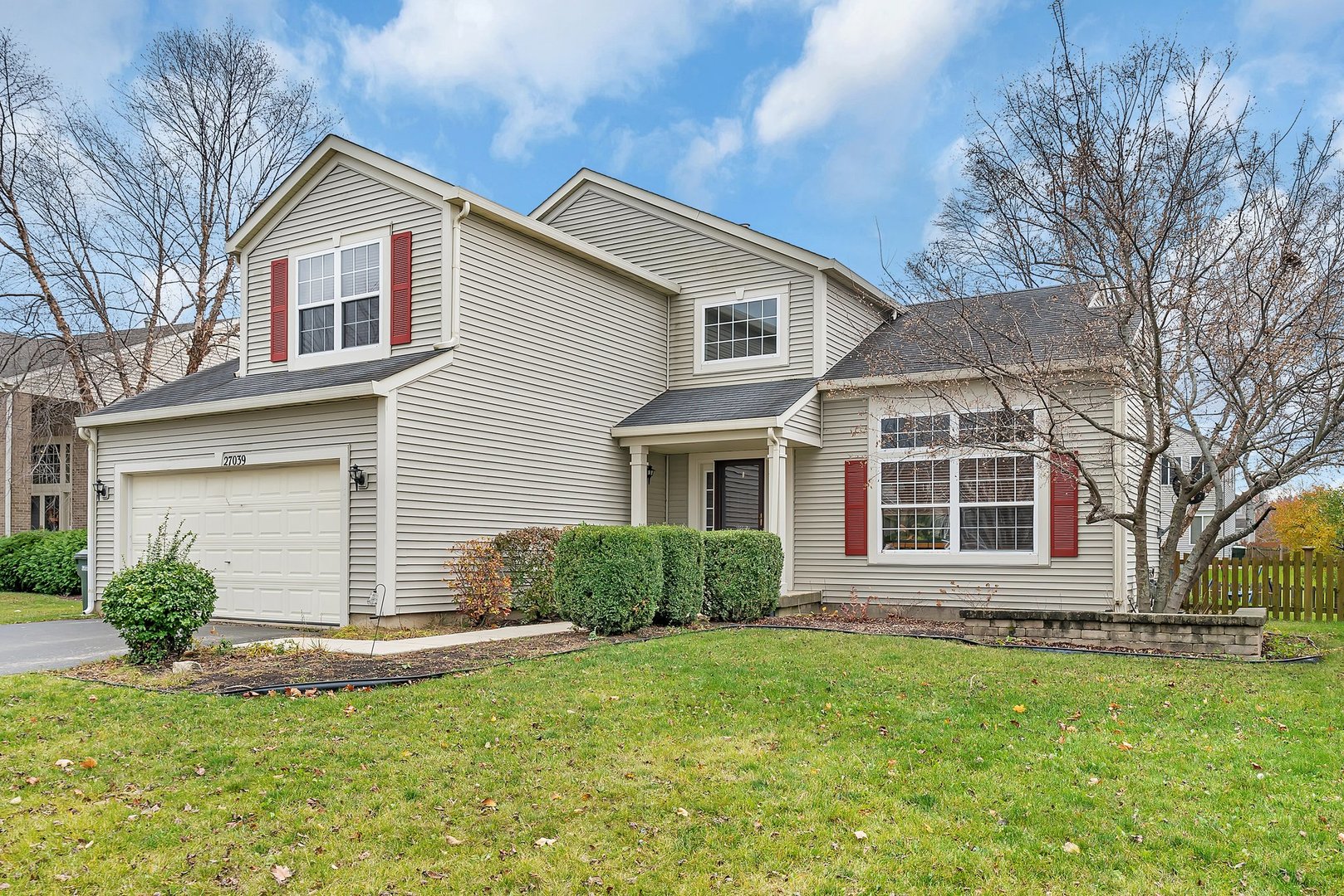27039 West Hemlock Road Channahon, IL 60410 - Photo 1 of 41 a front view of a house with a garden and plants
