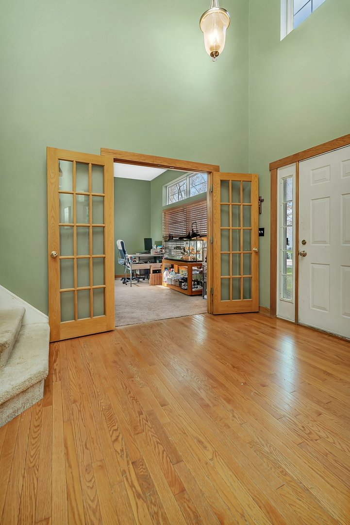 27039 West Hemlock Road Channahon, IL 60410 - Photo 17 of 41 a view of a livingroom with furniture and a window