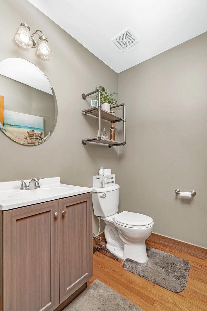 27039 West Hemlock Road Channahon, IL 60410 - Photo 21 of 41 a bathroom with a toilet a sink and mirror