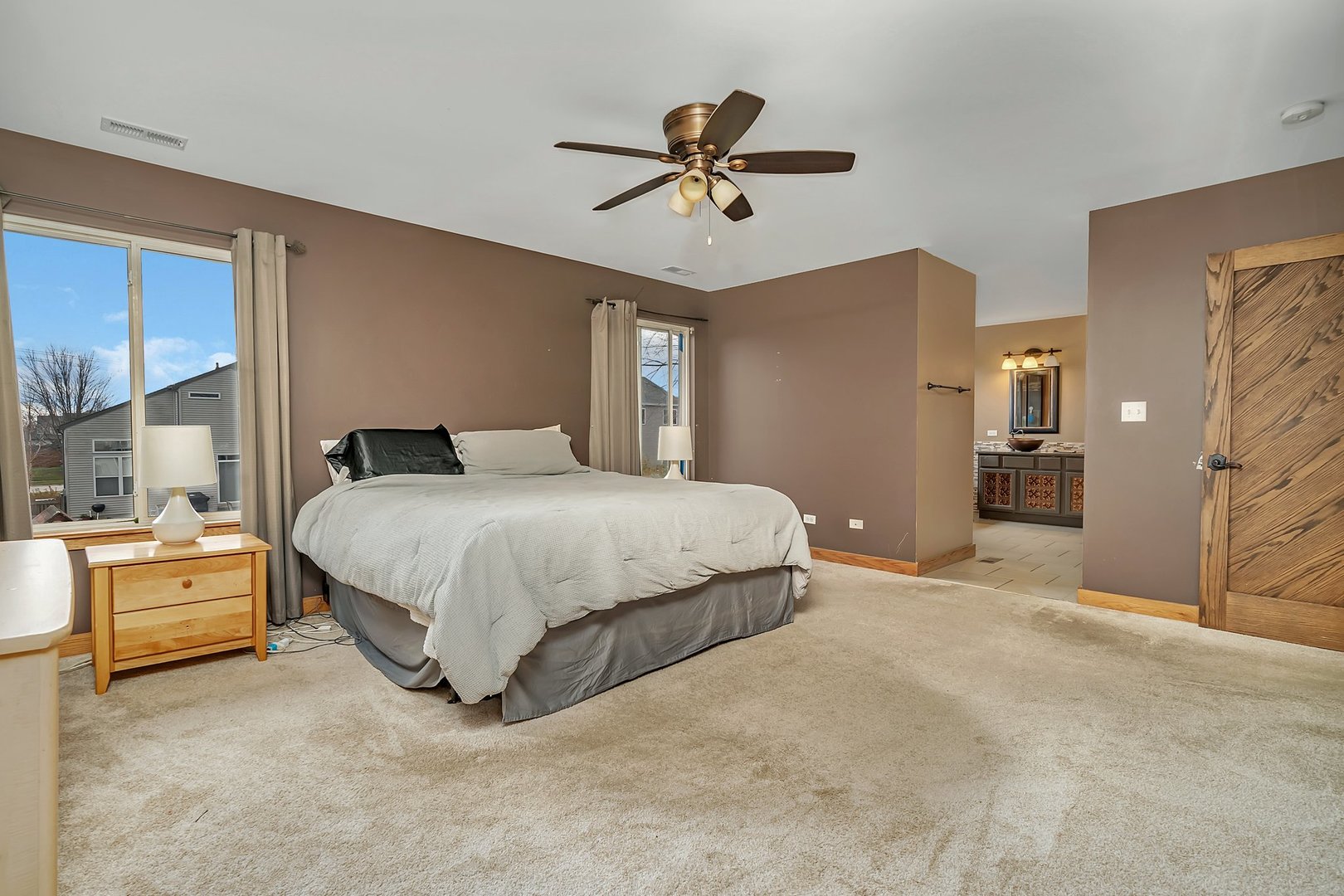27039 West Hemlock Road Channahon, IL 60410 - Photo 23 of 41 a bedroom with a bed and ceiling fan