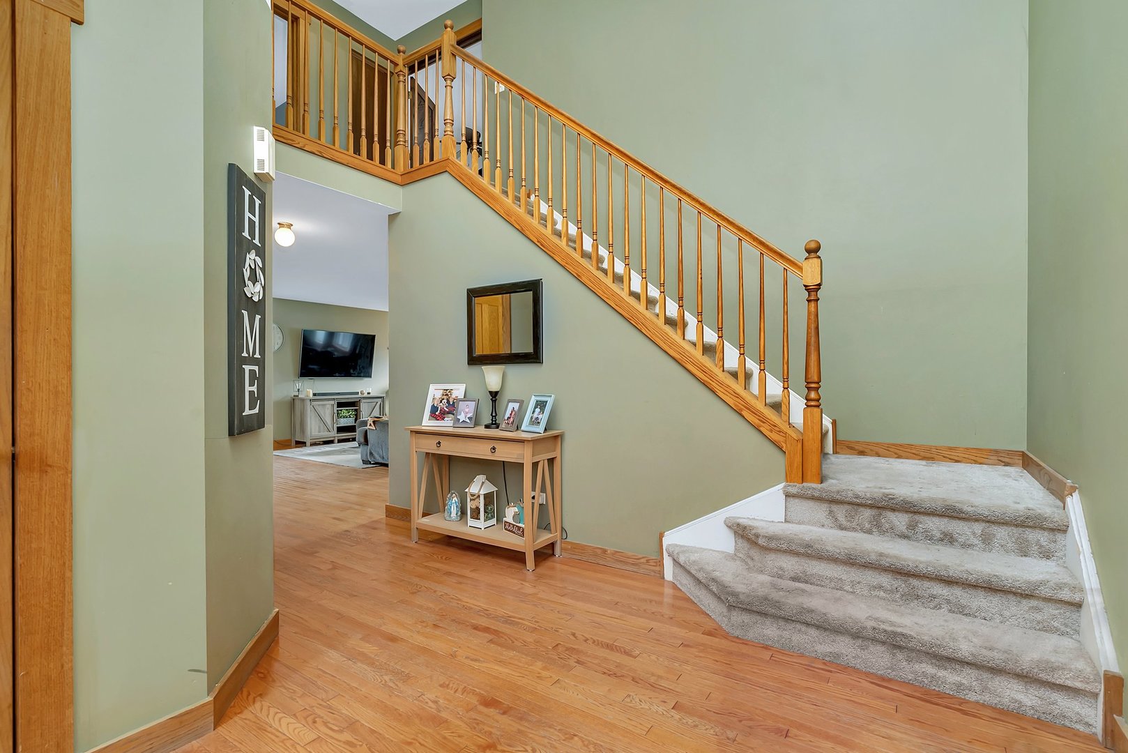 27039 West Hemlock Road Channahon, IL 60410 - Photo 3 of 41 a view of entryway livingroom and hall with wooden floor