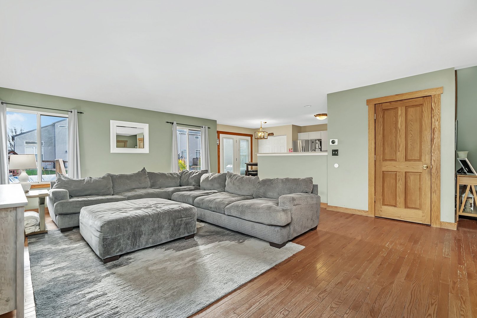27039 West Hemlock Road Channahon, IL 60410 - Photo 5 of 41 a living room with couches and a night stand
