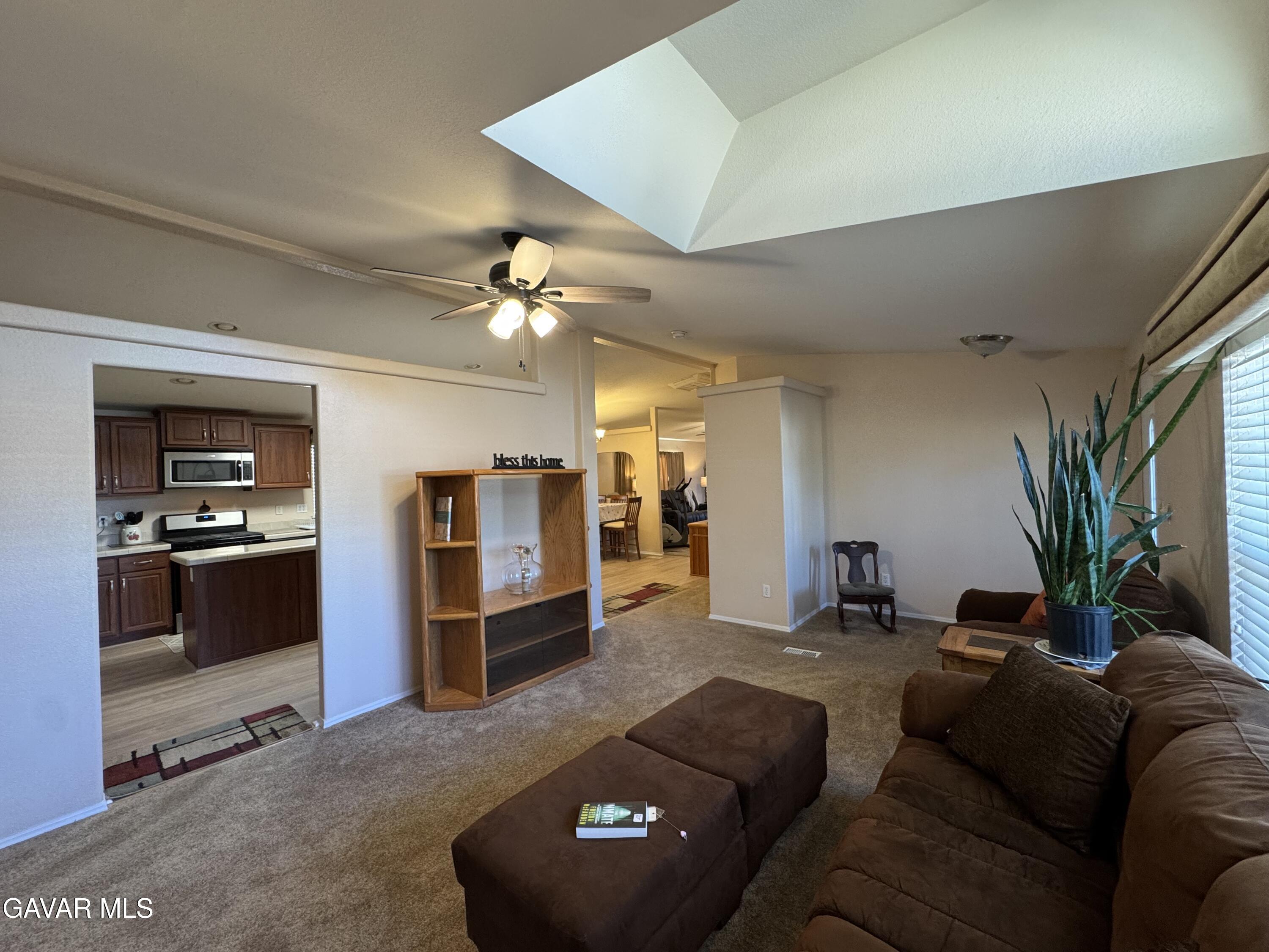 2000 Windflow Drive Rosamond, CA 93560 - Photo 12 of 48 a living room with furniture and a chandelier