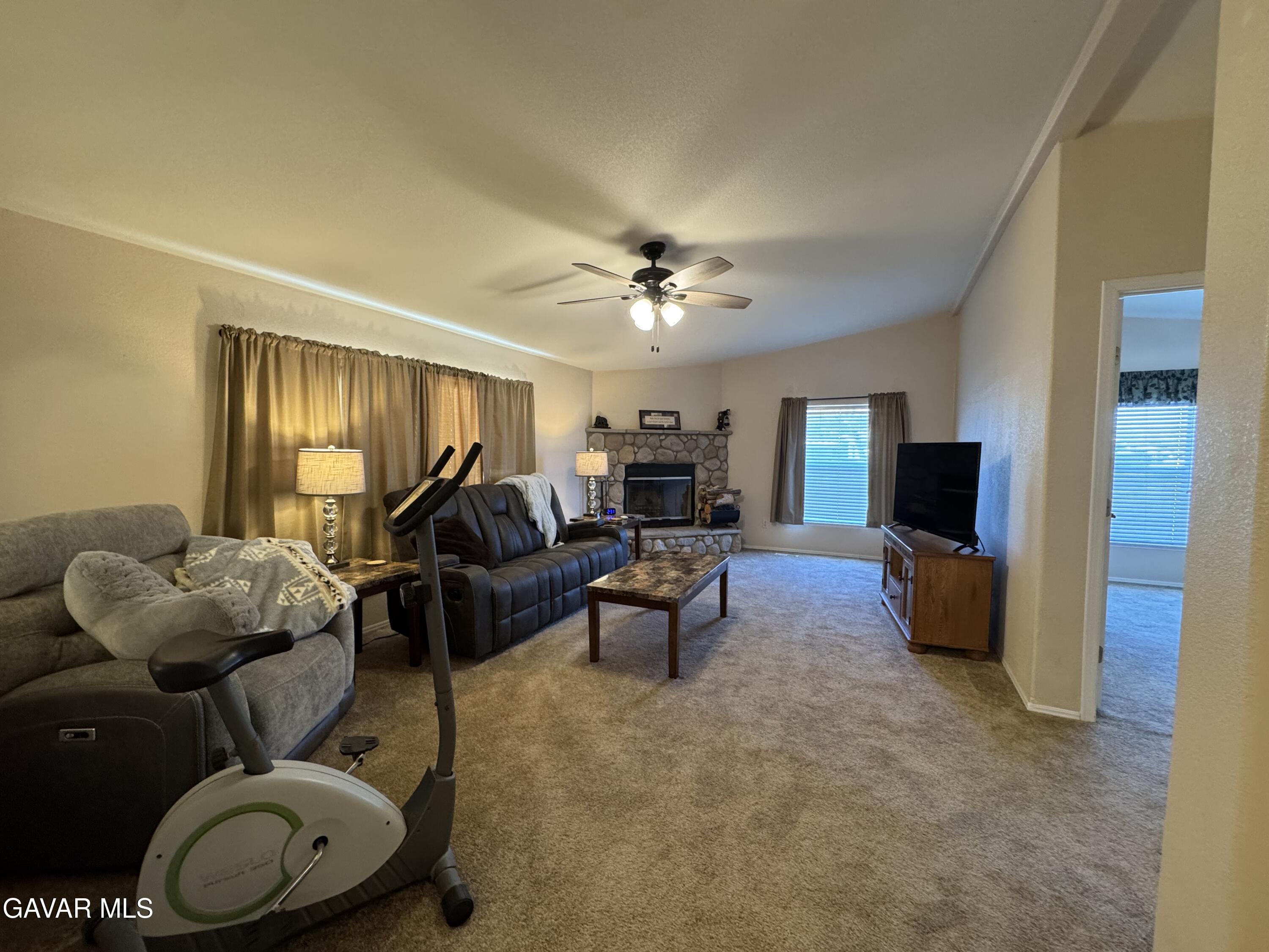 2000 Windflow Drive Rosamond, CA 93560 - Photo 18 of 48 a living room with furniture and a large window