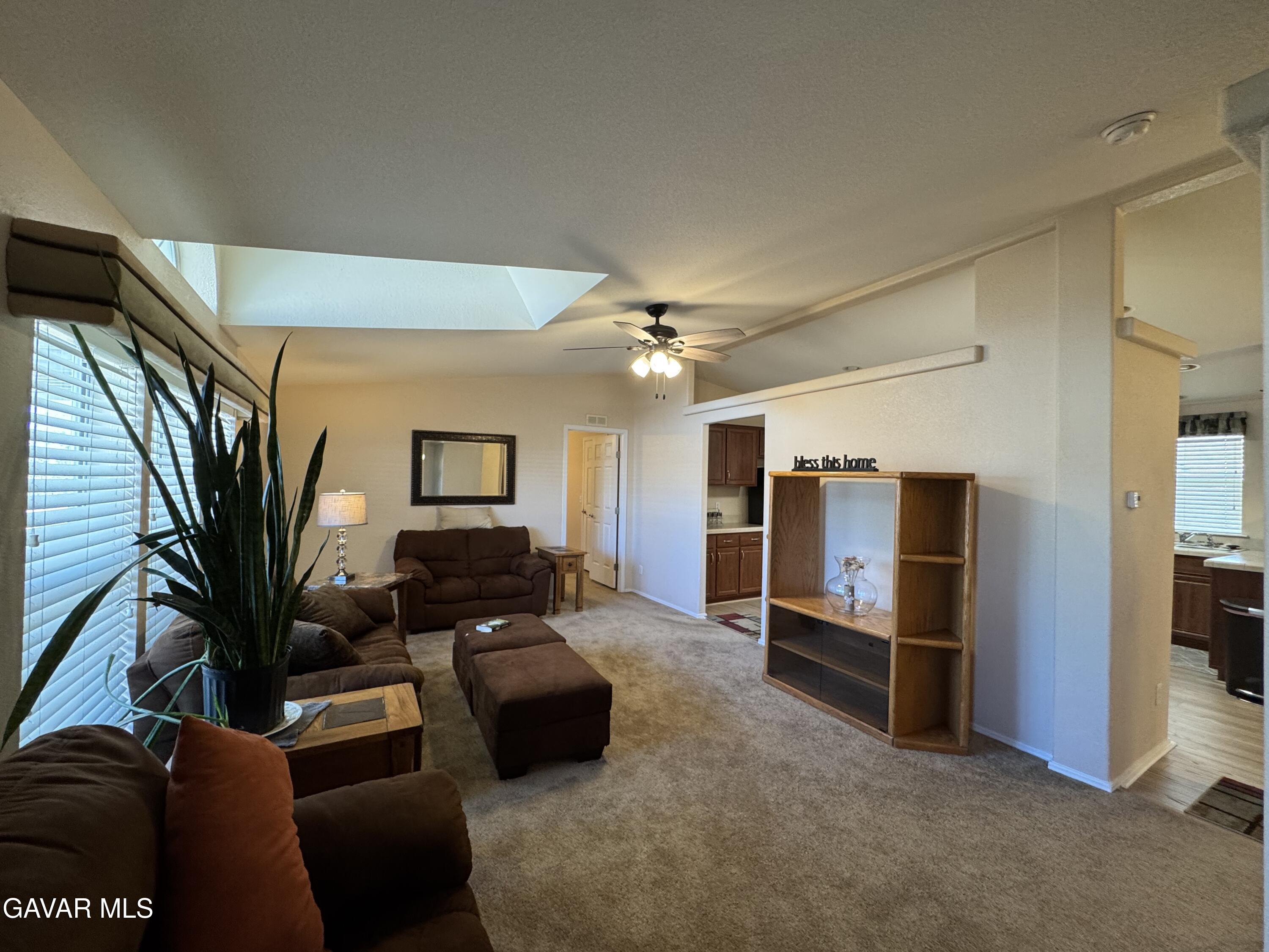 2000 Windflow Drive Rosamond, CA 93560 - Photo 21 of 48 a living room with furniture and a ceiling fan