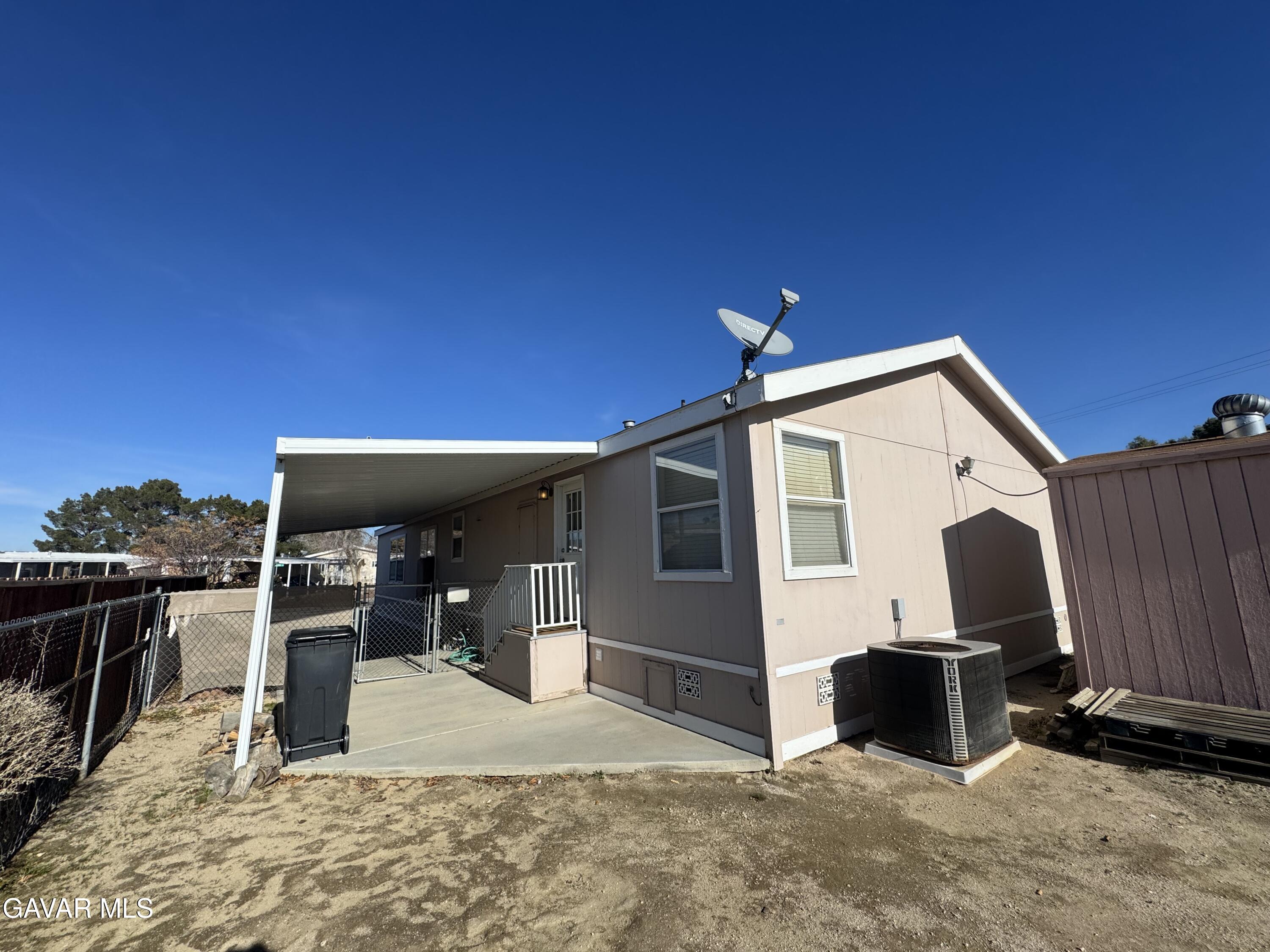 2000 Windflow Drive Rosamond, CA 93560 - Photo 39 of 48 a view of a patio with table and chairs