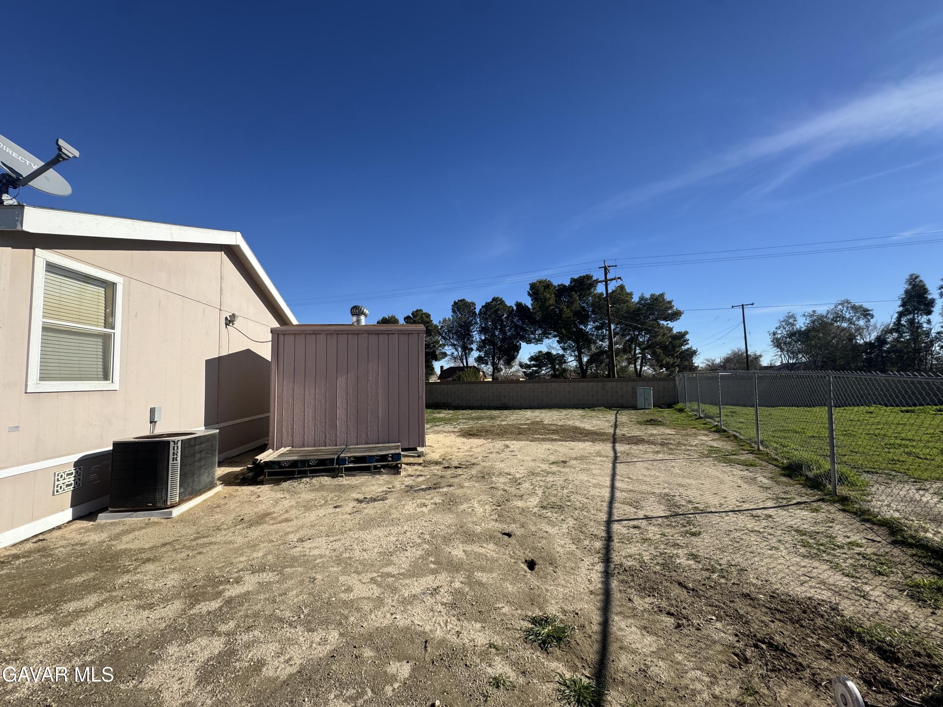 2000 Windflow Drive Rosamond, CA 93560 - Photo 40 of 48 a view of a house with a yard