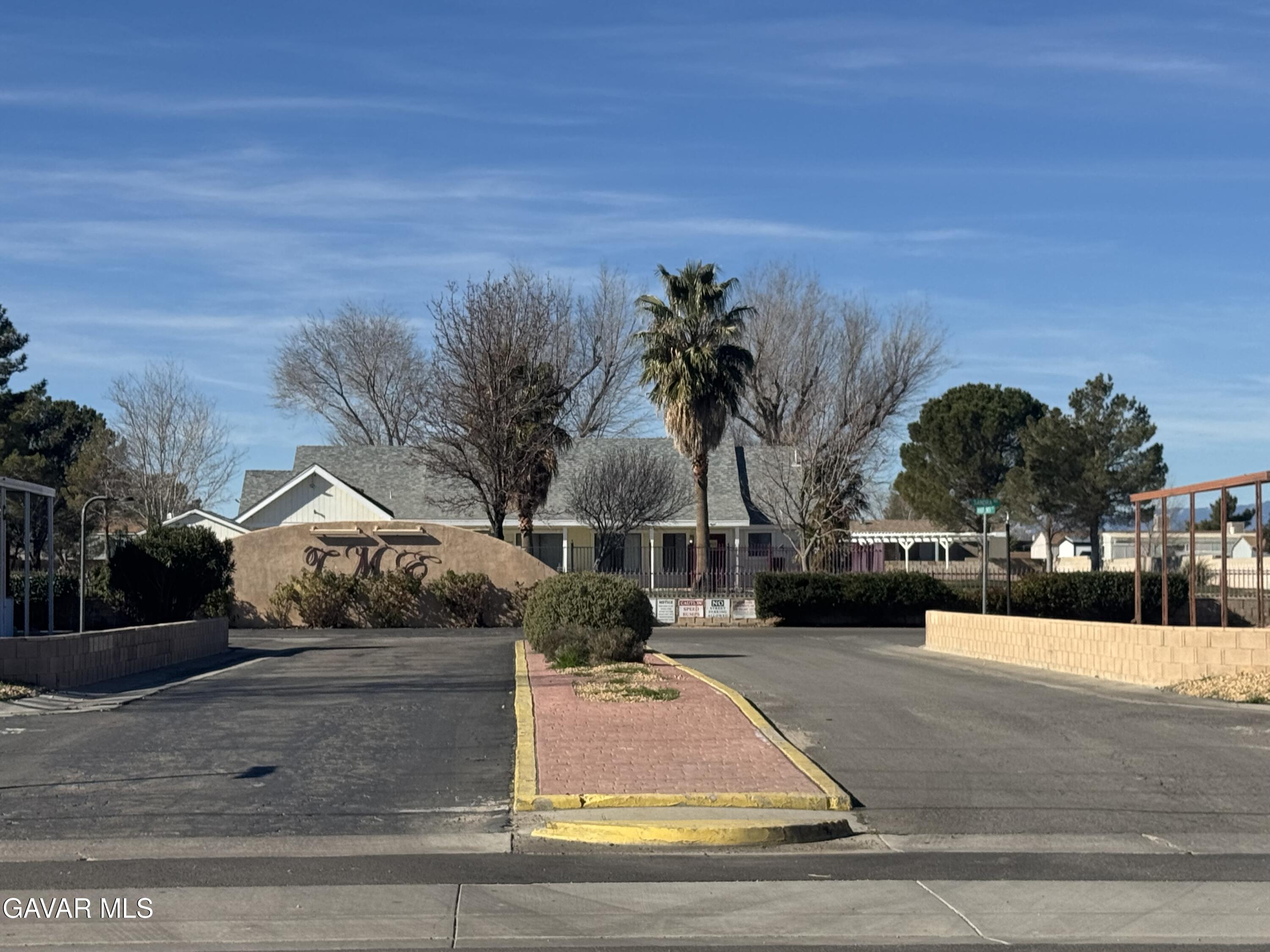 2000 Windflow Drive Rosamond, CA 93560 - Photo 48 of 48 a view of house with a yard and potted plants