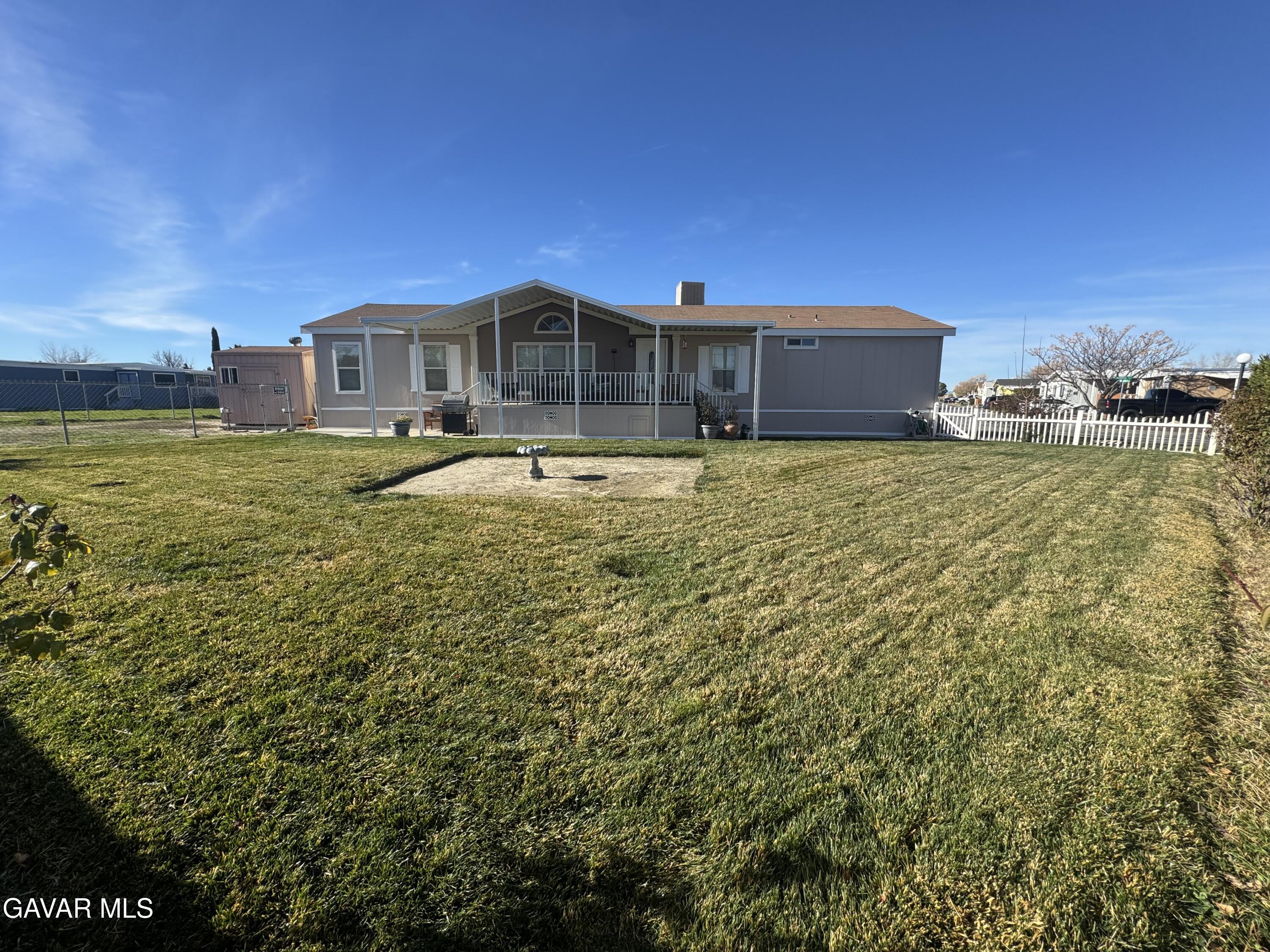 2000 Windflow Drive Rosamond, CA 93560 - Photo 5 of 48 a view of a house with a yard