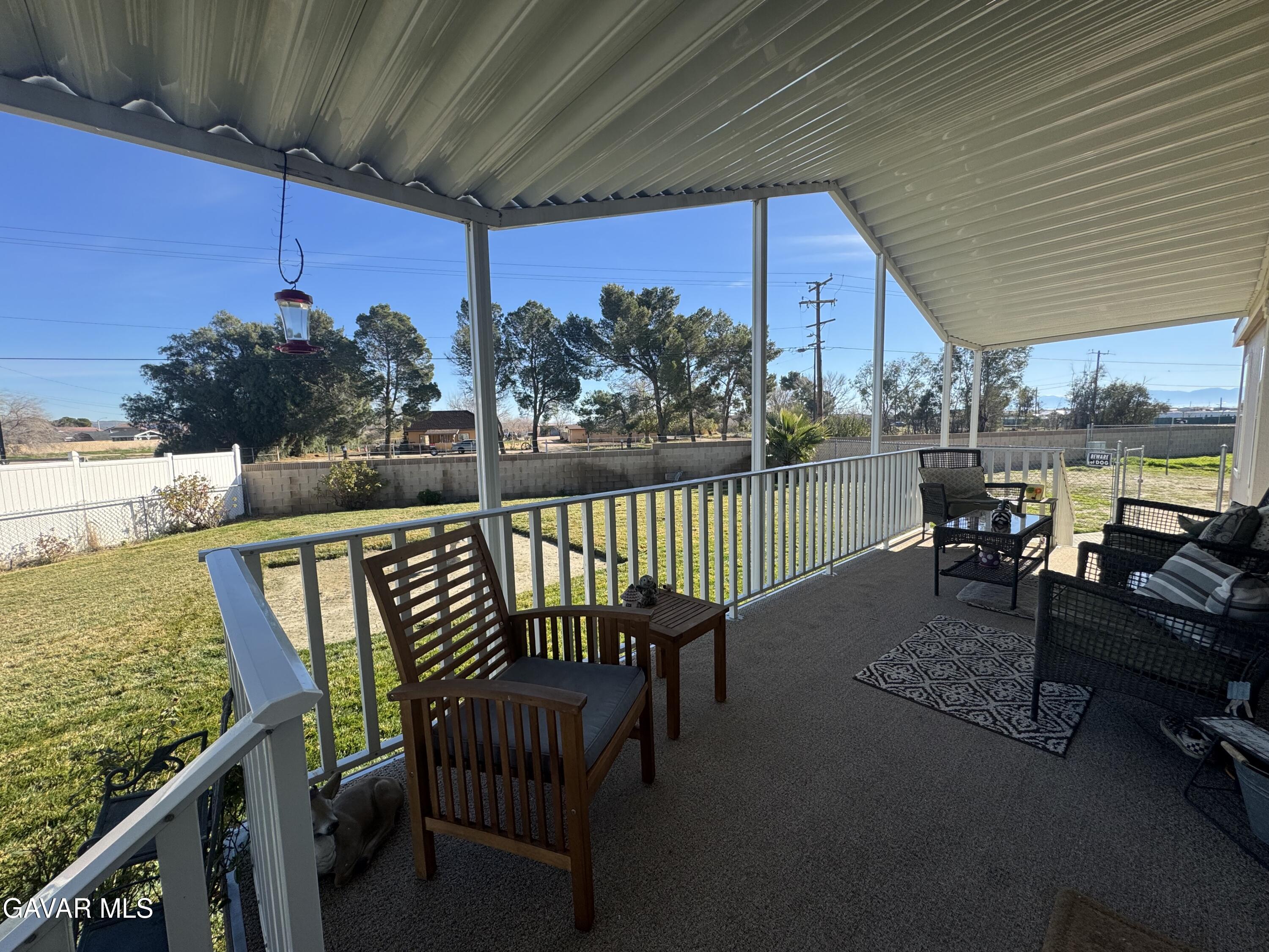 2000 Windflow Drive Rosamond, CA 93560 - Photo 7 of 48 a view of a chairs and table in the balcony