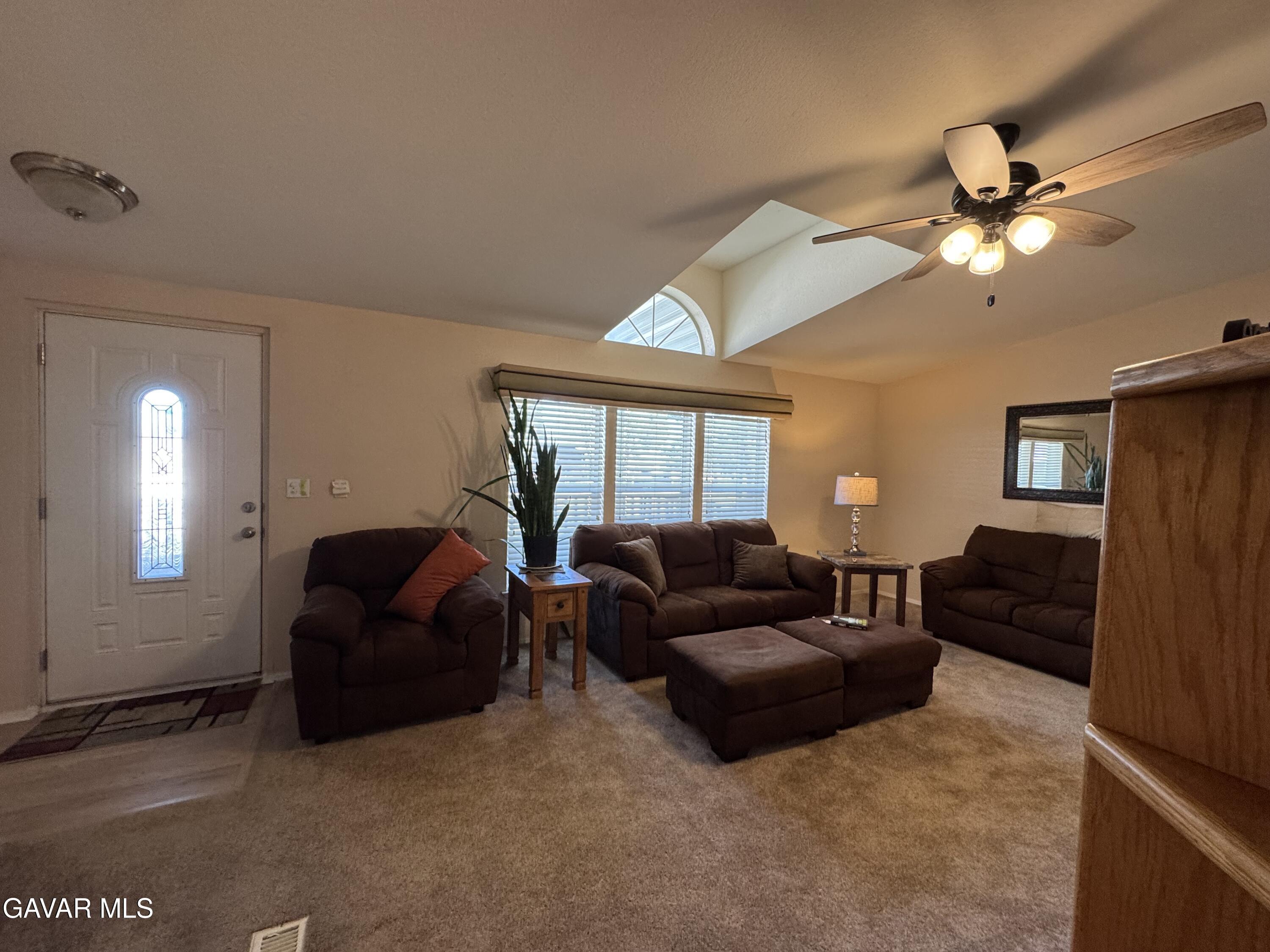 2000 Windflow Drive Rosamond, CA 93560 - Photo 9 of 48 a living room with furniture a ceiling fan and a window