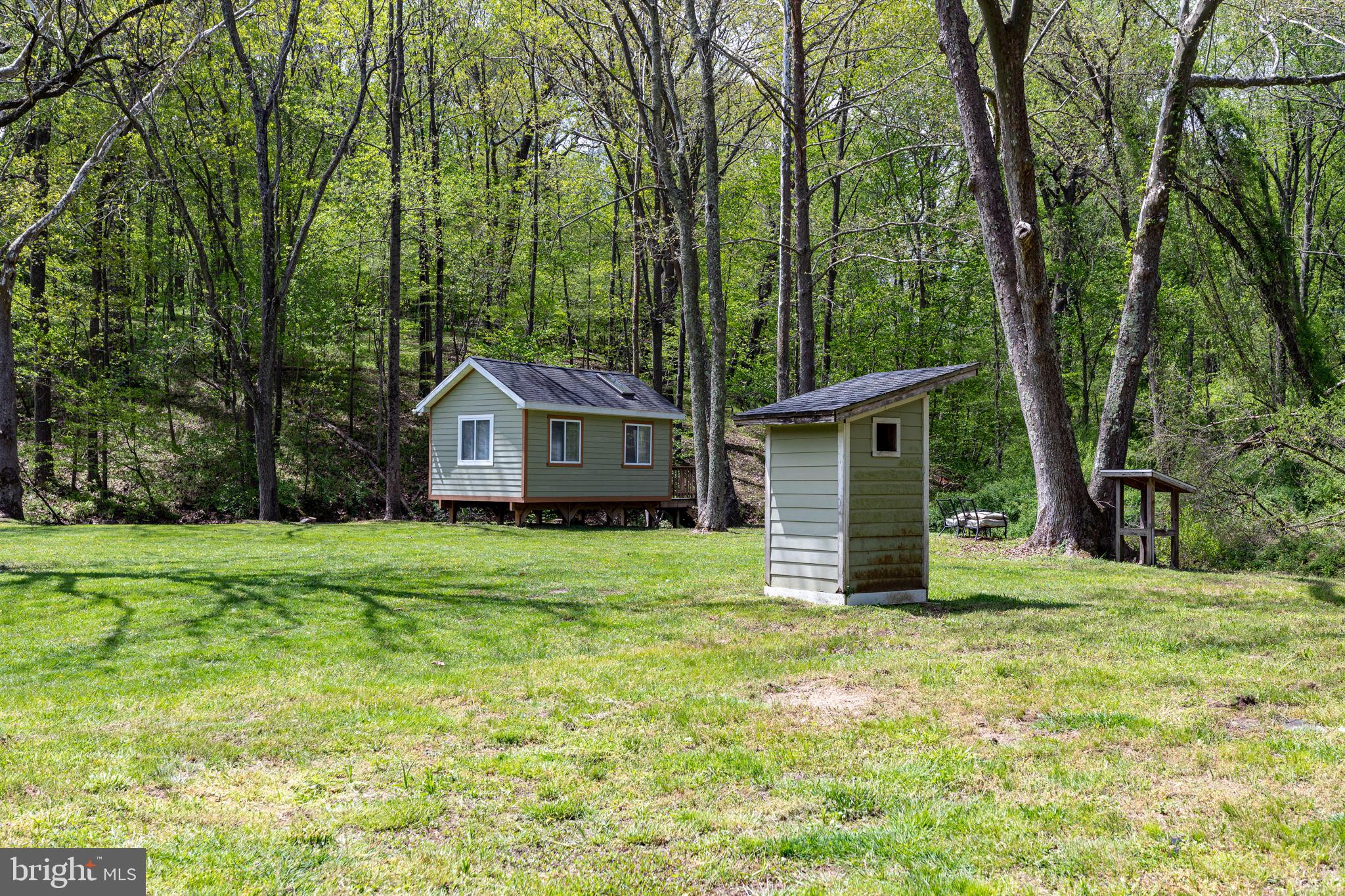 2310 Putnam Road Forest Hill, MD 21050 - Photo 22 of 90 Charming cabin nestled in lush greenery.