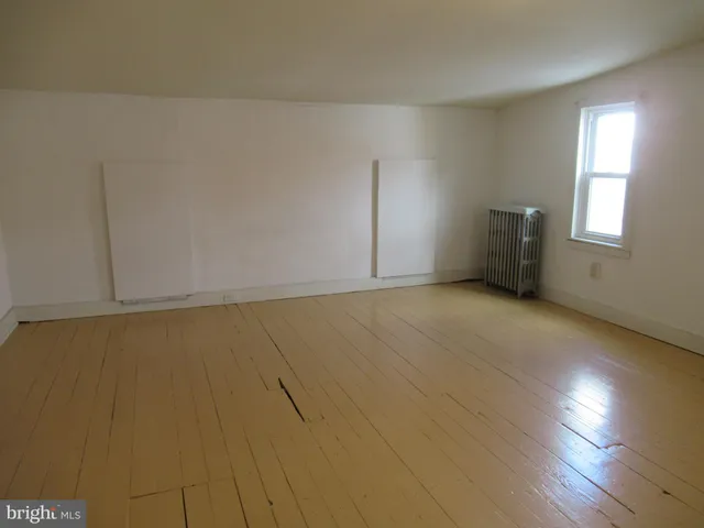 a bathroom with a tub and shower