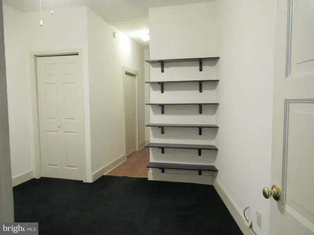 a kitchen with a refrigerator and a sink