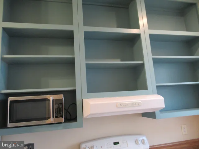 a white refrigerator freezer sitting in a kitchen