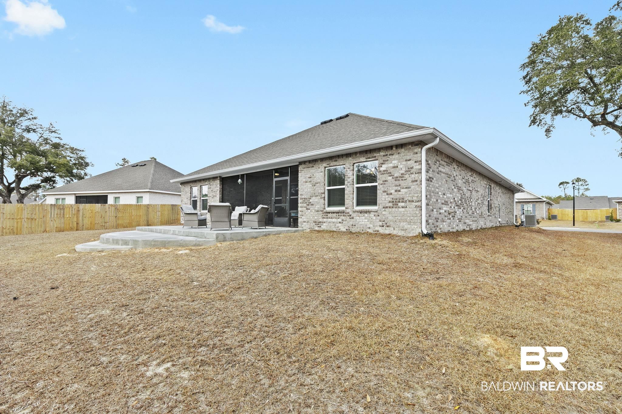 1141 Pencarro Boulevard Foley, AL 36535 - Photo 57 of 70 Rear view of property featuring a sunroom and a patio