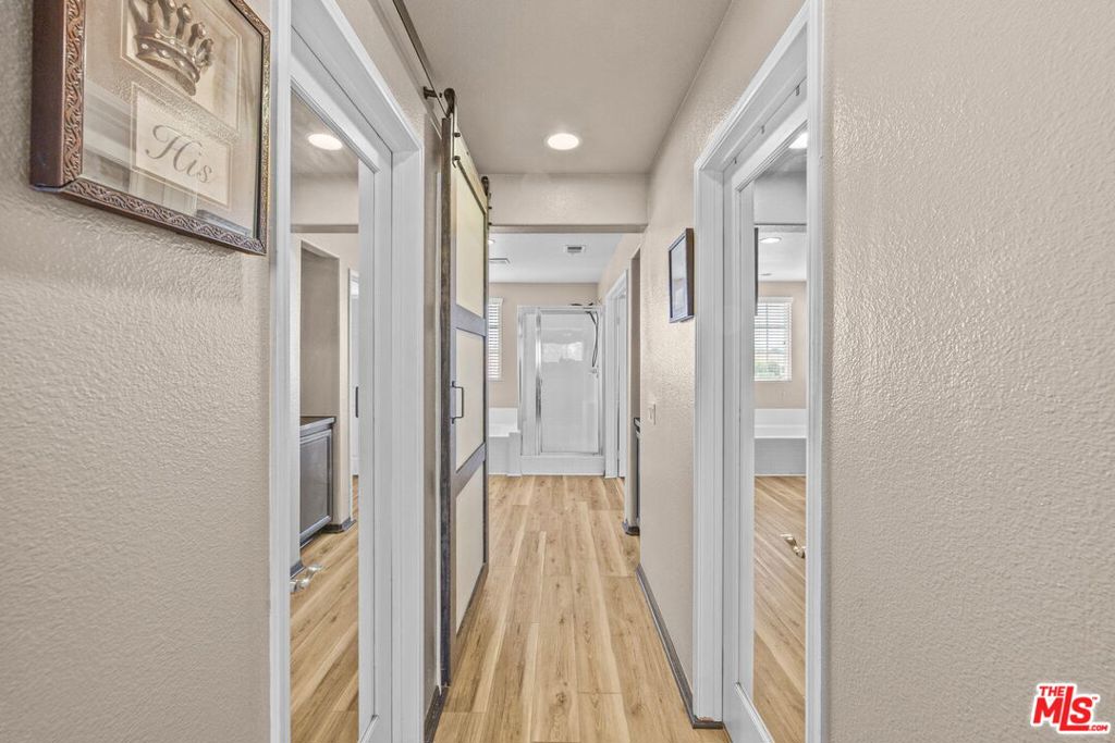 26692 Rim Creek Path, Unit PATHWAY Menifee, CA 92584 - Photo 22 of 41 a bathroom with a glass shower door