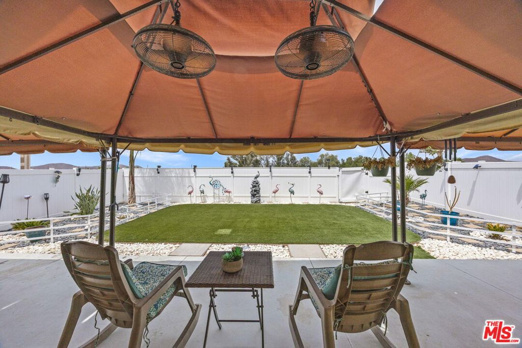26692 Rim Creek Path, Unit PATHWAY Menifee, CA 92584 - Photo 29 of 41 a view of yard with table and chairs