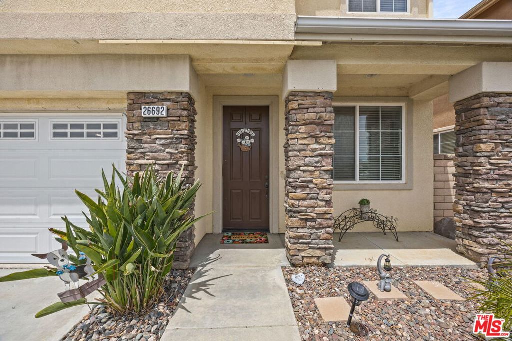 26692 Rim Creek Path, Unit PATHWAY Menifee, CA 92584 - Photo 3 of 41 a front view of a house
