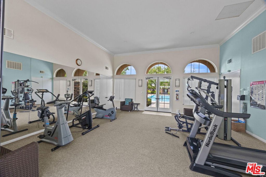 26692 Rim Creek Path, Unit PATHWAY Menifee, CA 92584 - Photo 35 of 41 a view of a room with gym equipment