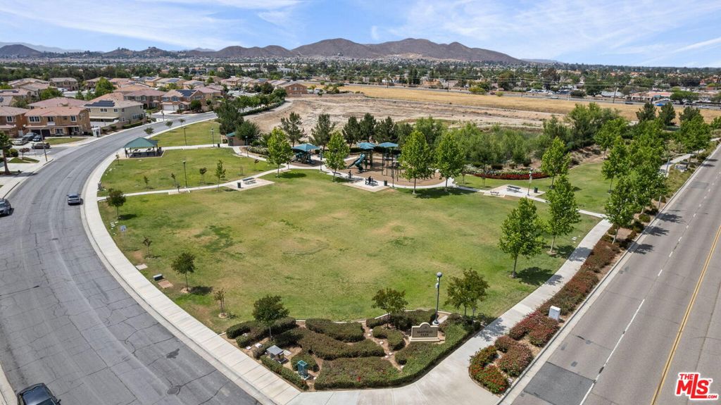 26692 Rim Creek Path, Unit PATHWAY Menifee, CA 92584 - Photo 41 of 41 a view of a swimming pool with a lake and mountain view