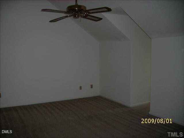 4103 Kaplan Drive Raleigh, NC 27606 - Photo 4 of 7 an empty room with a workbench