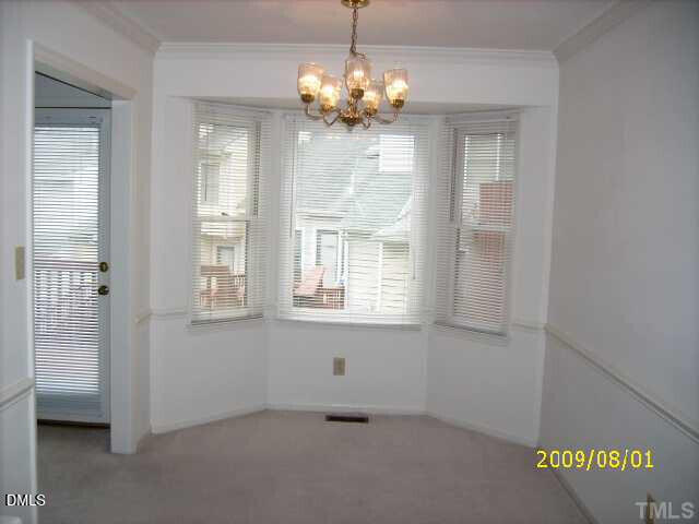 4103 Kaplan Drive Raleigh, NC 27606 - Photo 5 of 7 a view of an empty room with a window