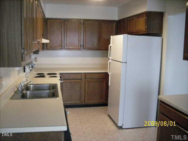 4103 Kaplan Drive Raleigh, NC 27606 - Photo 6 of 7 a utility room with dryer and washer