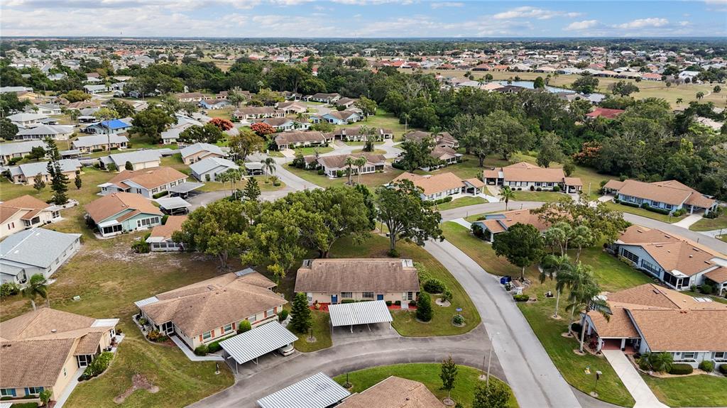 409 Feltham Trail, Unit B Sun City Center, FL 33573 - Photo 6 of 34 an aerial view of residential houses with outdoor space