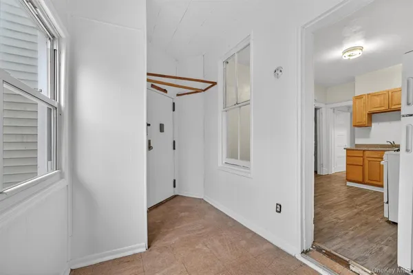 a view of a kitchen with a refrigerator