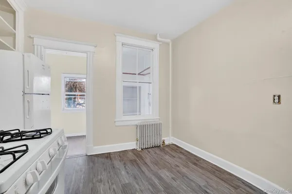 a view of kitchen with furniture and wooden floor