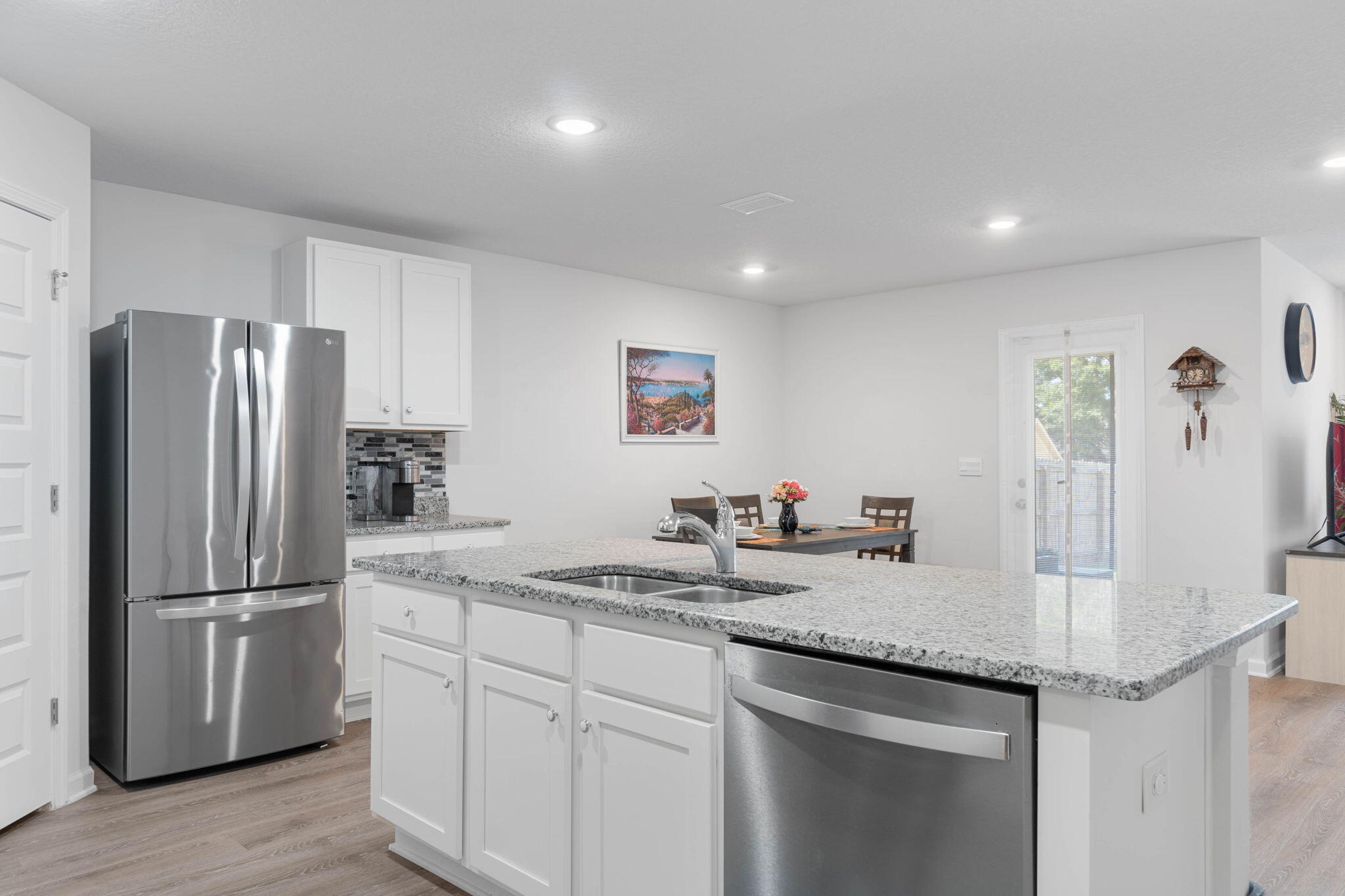 4614 Honor Guard Way Crestview, FL 32539 - Photo 15 of 48 a kitchen with stainless steel appliances granite countertop a refrigerator and a sink