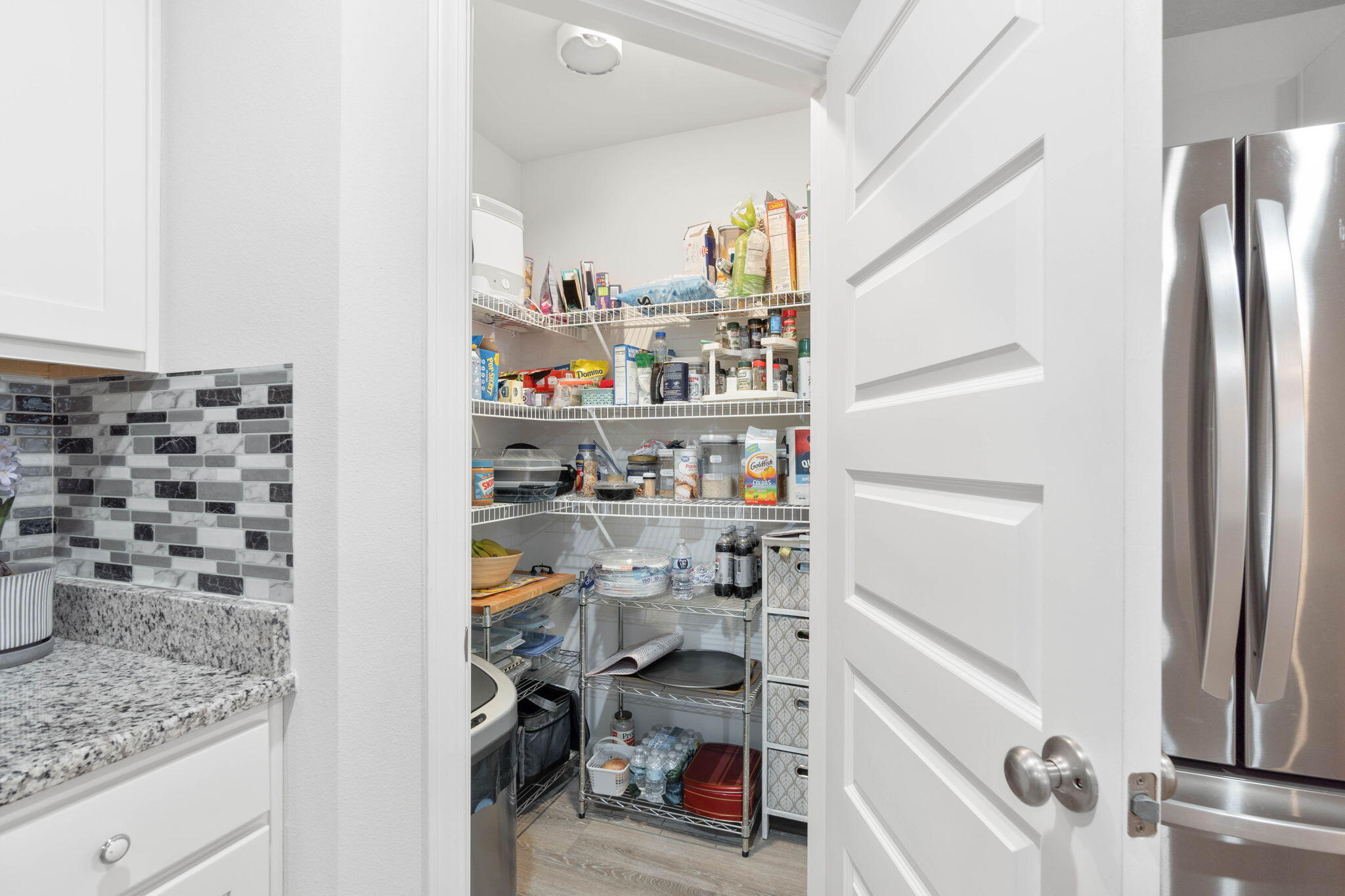 4614 Honor Guard Way Crestview, FL 32539 - Photo 17 of 48 a view of walk in closet with clothes and shoes