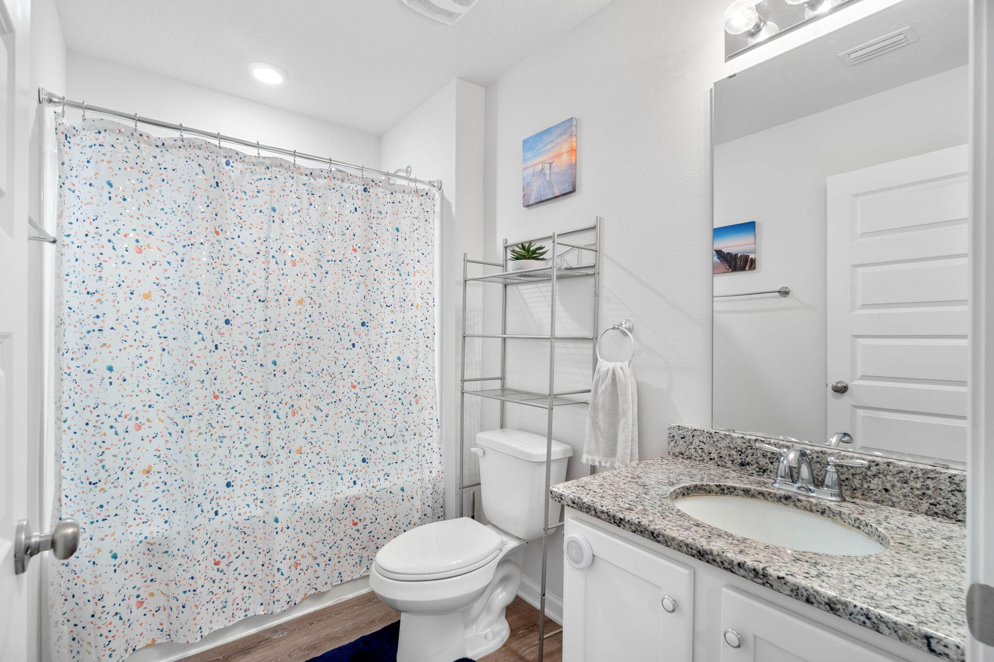 4614 Honor Guard Way Crestview, FL 32539 - Photo 24 of 48 a bathroom with a granite countertop sink toilet and shower