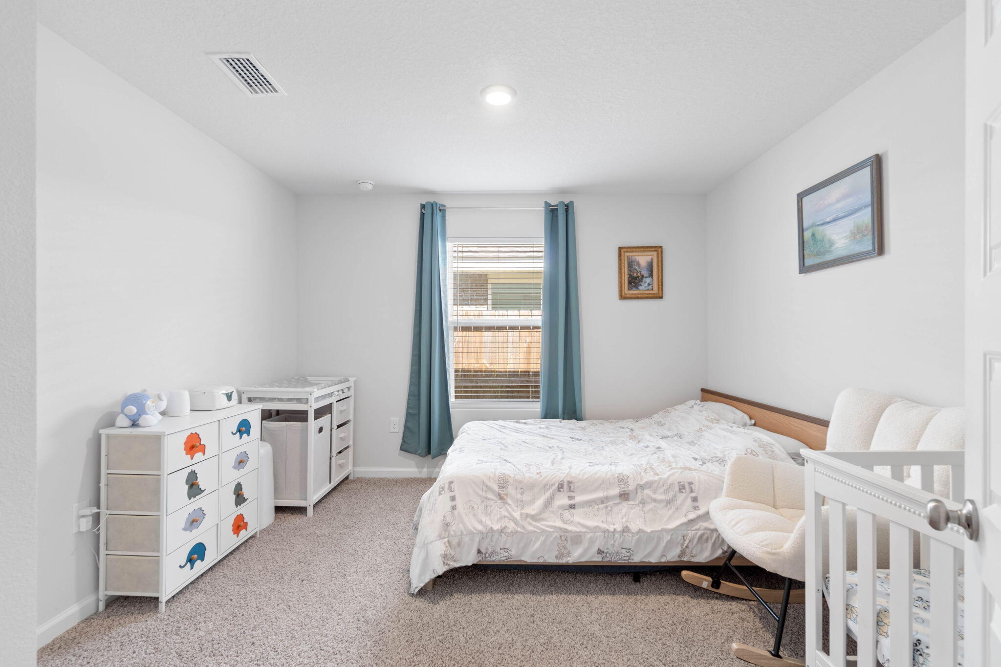 4614 Honor Guard Way Crestview, FL 32539 - Photo 27 of 48 a bedroom with a bed and a window