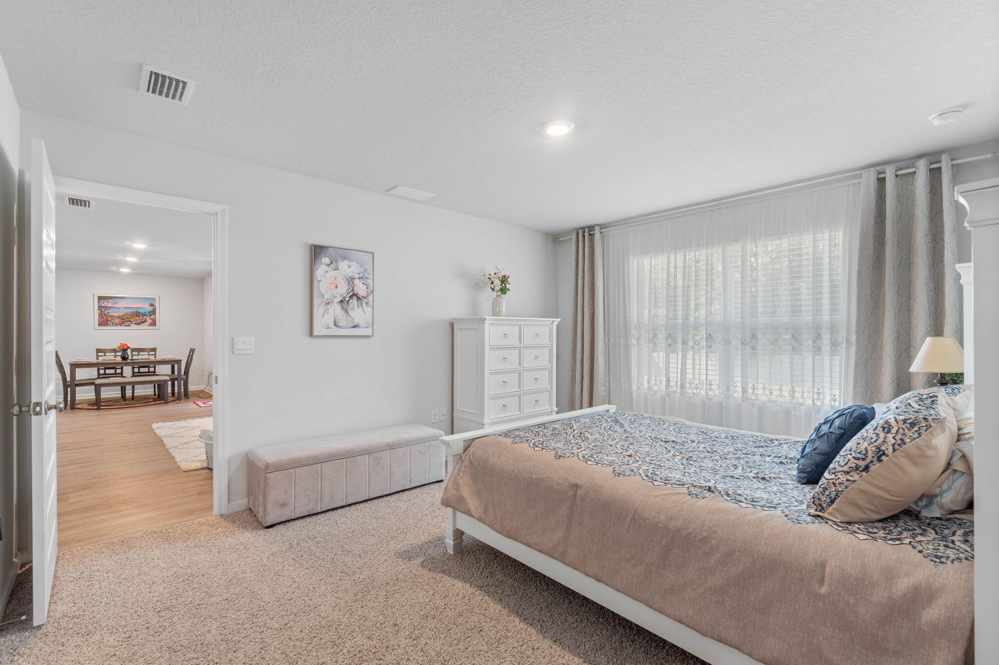 4614 Honor Guard Way Crestview, FL 32539 - Photo 29 of 48 a spacious bedroom with a bed and a large window