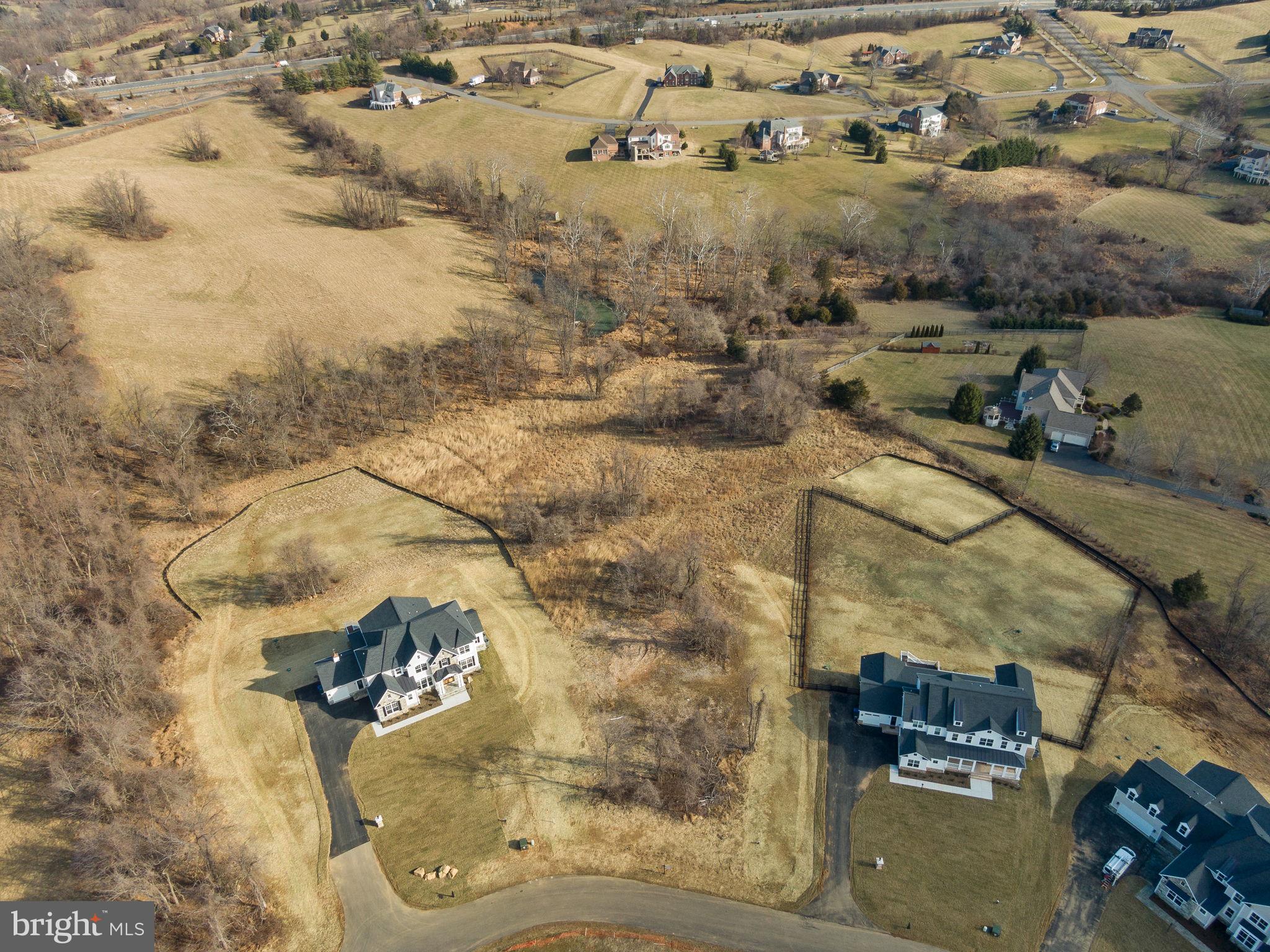 a aerial view of a house with a yard