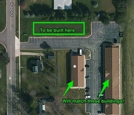 a view of a entrance gate of a house with a garden