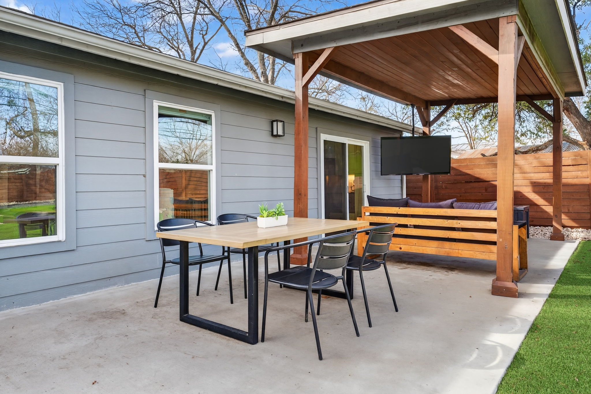 504 West Croslin Street Austin, TX 78752 - Photo 20 of 22 a backyard of a house with barbeque oven table and chairs