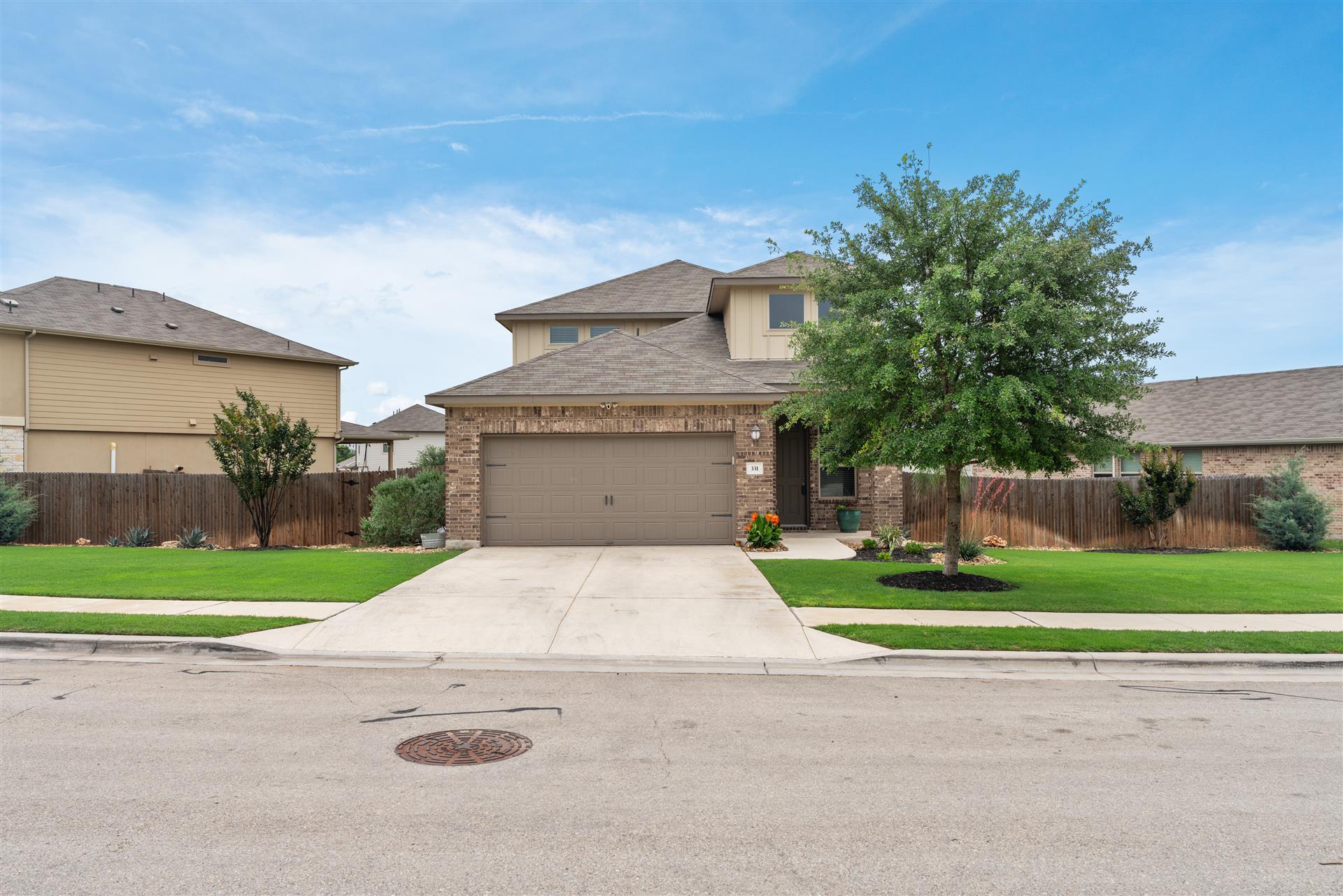331 Mountain Valley Street Georgetown, TX 78628 - Photo 2 of 40 Beautiful 2-Story with 3-sides Brick exterior, hardi-plank on rear situated on oversize lot appx 1/4 acre