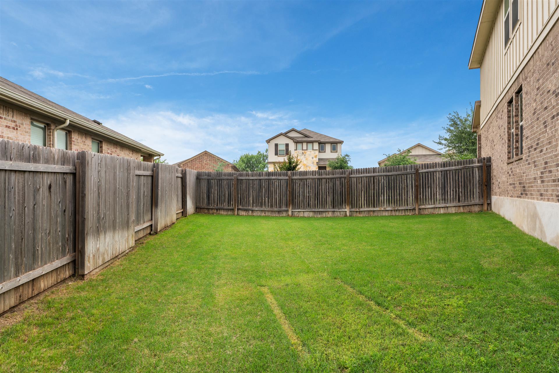 331 Mountain Valley Street Georgetown, TX 78628 - Photo 34 of 40 a view of a back yard