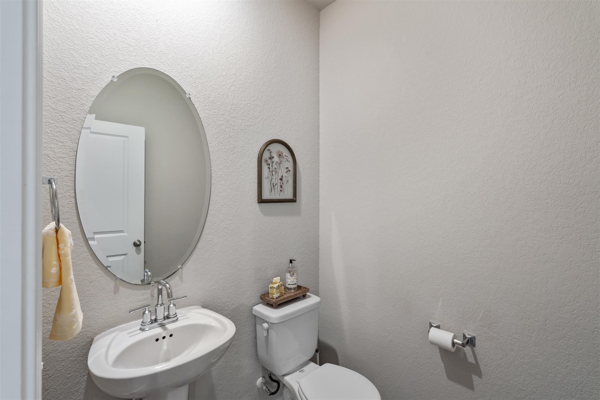 331 Mountain Valley Street Georgetown, TX 78628 - Photo 6 of 40 Powder bath conveniently located downstairs for guests and family