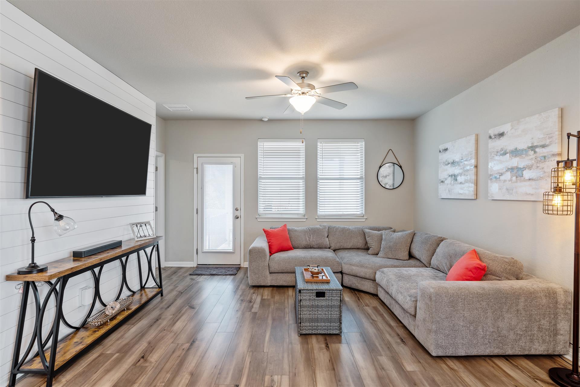 331 Mountain Valley Street Georgetown, TX 78628 - Photo 7 of 40 Large Living area featuring shiplap wall and wood-style flooring