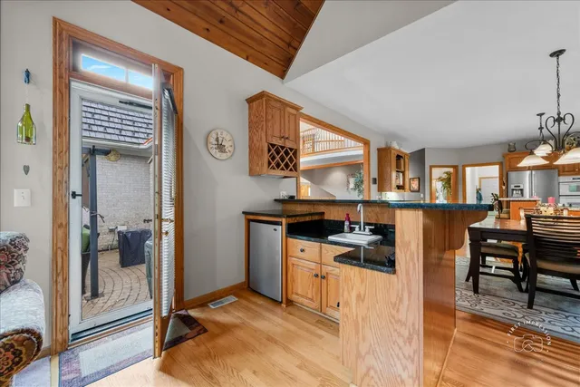 a kitchen with stainless steel appliances granite countertop a stove and a refrigerator
